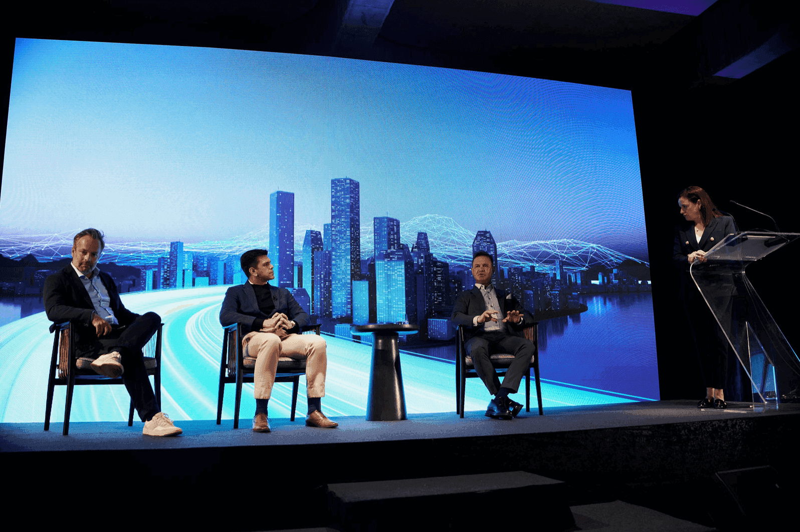 Panel and moderator on the Global Symposium stage